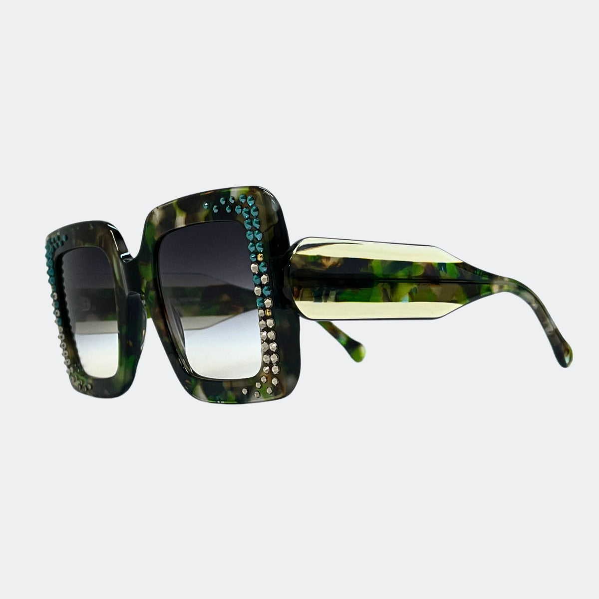 Sunglasses with a green tortoiseshell frame and crystal embellishments