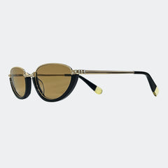 Sunglasses with vintage Swarovski crystal gold frame and black arms on a light gray background