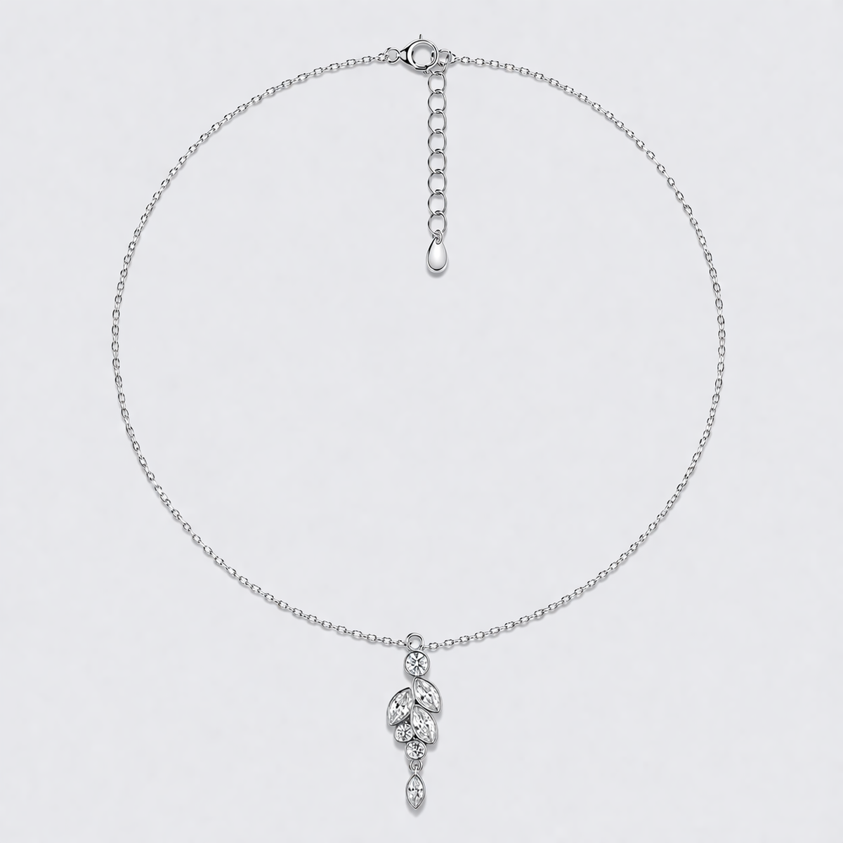 Silver necklace with a delicate Austrian crystal pendant on a light gray background