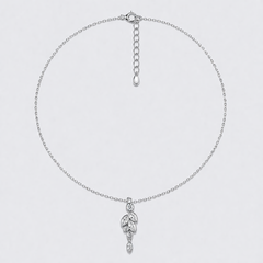 Silver necklace with a delicate Austrian crystal pendant on a light gray background