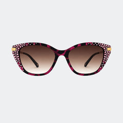 Sunglasses with Swarovski crystal decorative frame on a light gray background