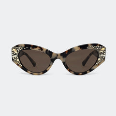 Cats-eye sunglasses with a tortoiseshell pattern, gold rhinestone embellishments on the outer corners, and dark brown lenses, shown against a light gray background.