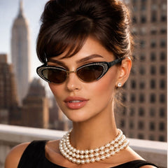 Woman wearing retro vintage sunglasses with crystals in AUDREY style